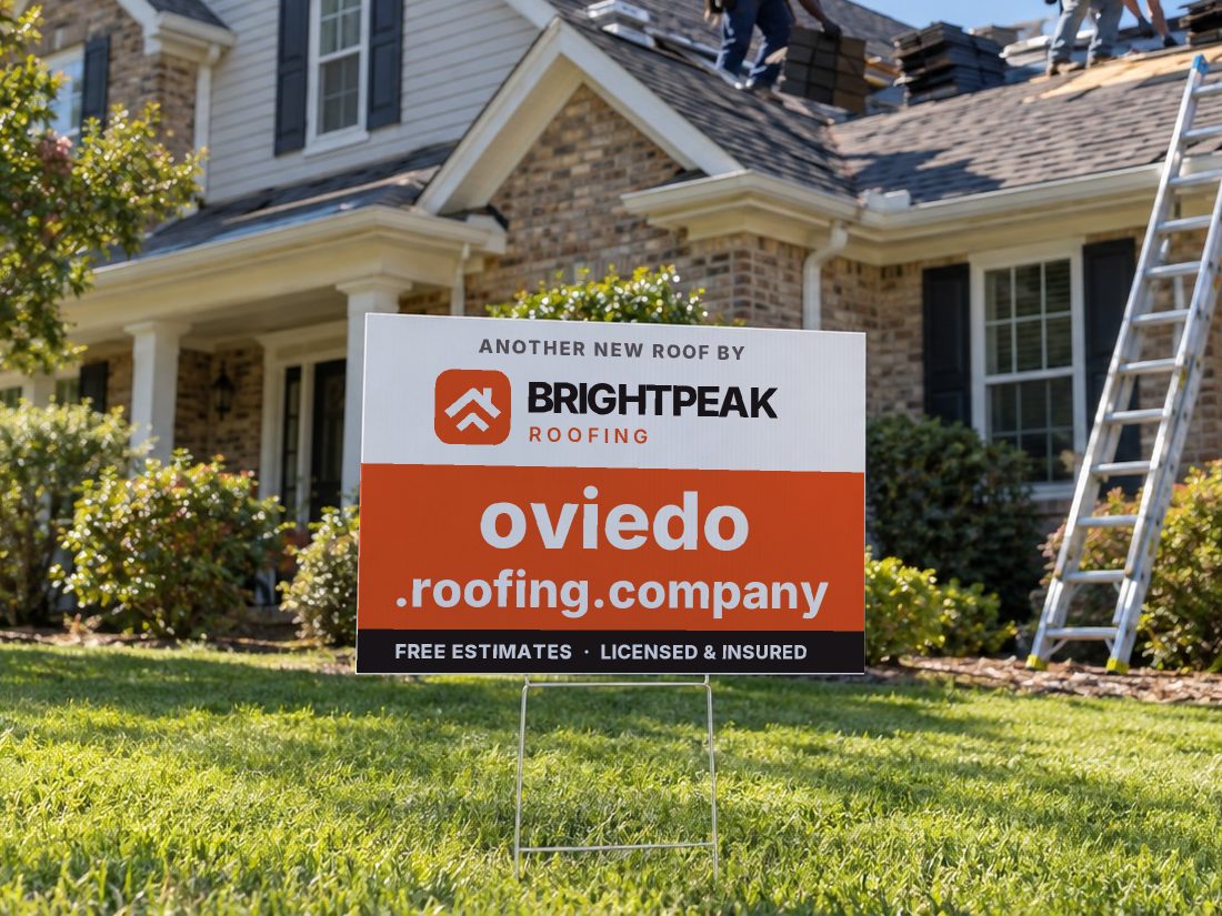 oviedo.roofing.company on a yard sign in front of a house getting a new roof